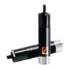 Black cylindrical metal motor, one standing vertically and one lying