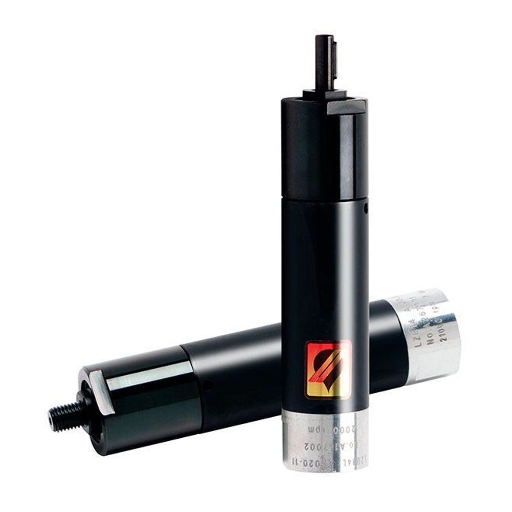 Black cylindrical metal motor, one standing vertically and one lying