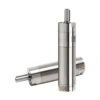 Two silver cylindrical air motors, one standing upright and one placed