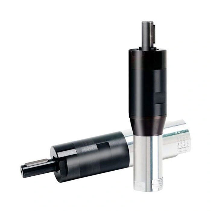 Two cylindrical air motors, one black and one black-and-silver, shown