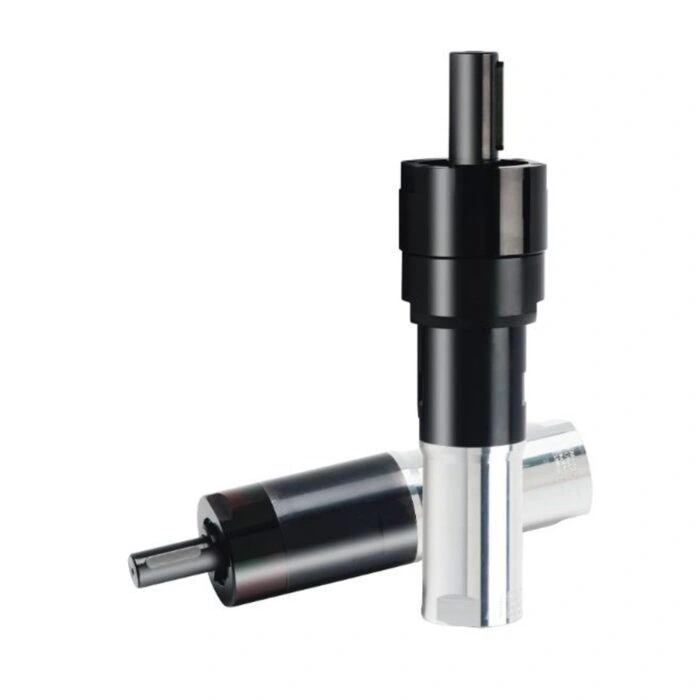Two black-and-silver cylindrical motor bodies, one standing and one angled