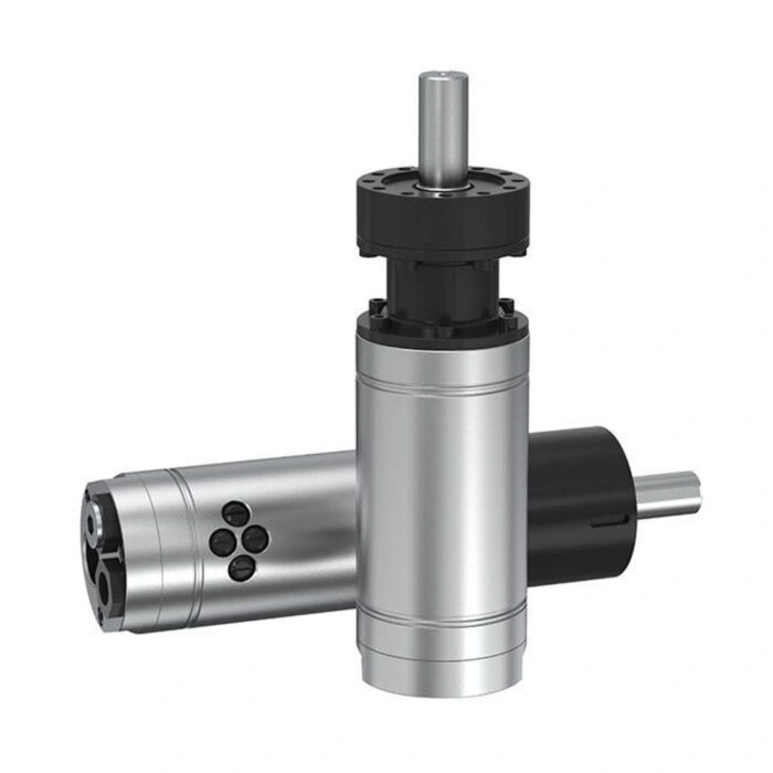 Front angled view of two cylindrical air motors, one upright and one lying