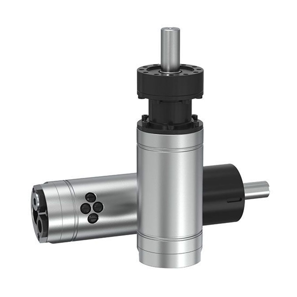 Front angled view of two cylindrical air motors, one upright and one lying