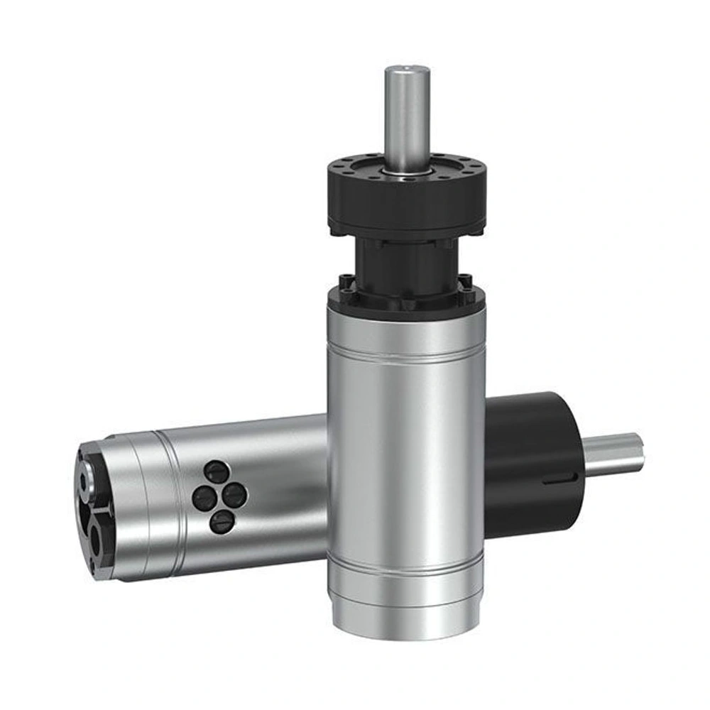 Front angled view of two cylindrical air motors, one upright and one lying