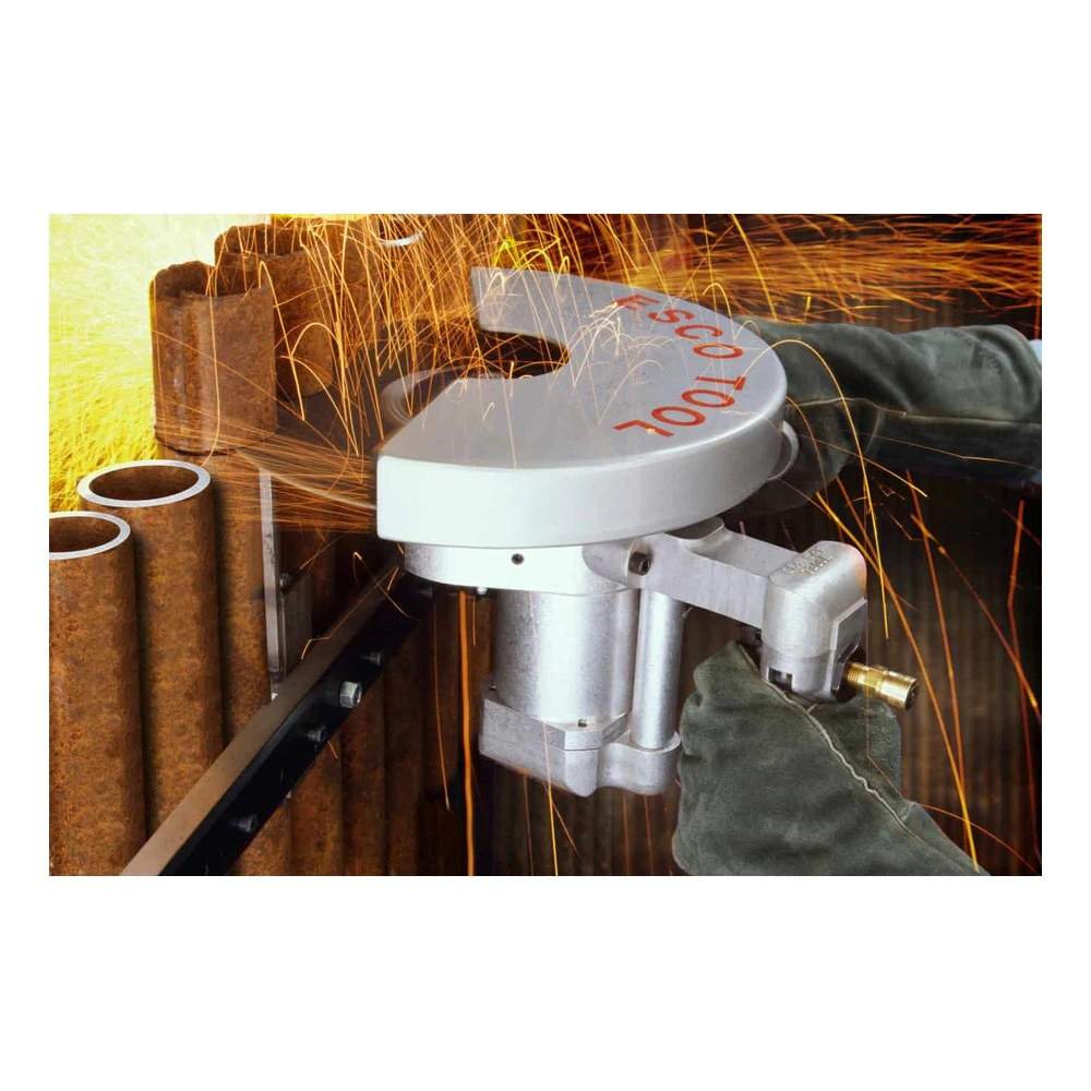 מסור חיתוך נייד עם מגן עגול ועליו כיתוב Esco Tool, חותך צינורות חלודים - Portable cutting saw with a round guard labeled Esco Tool, cutting rusty