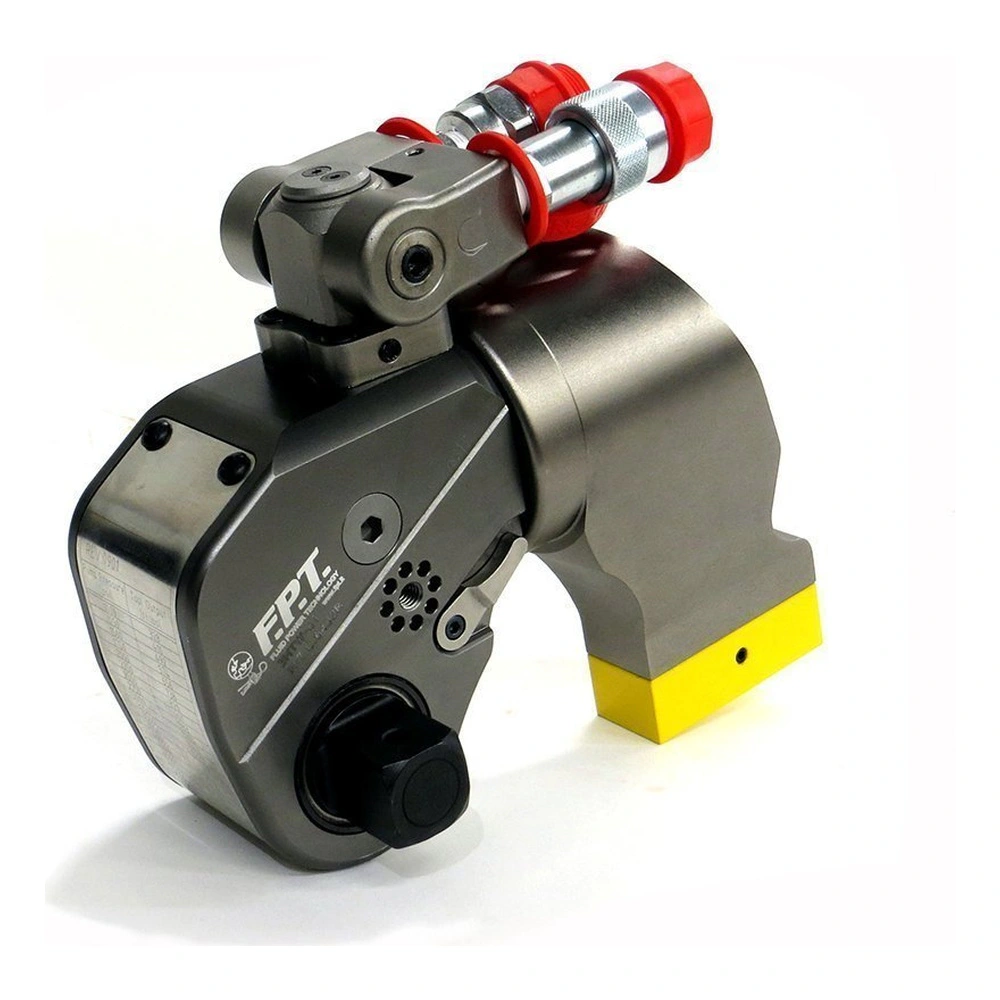 A gray and black hydraulic torque wrench with red fittings and a yellow