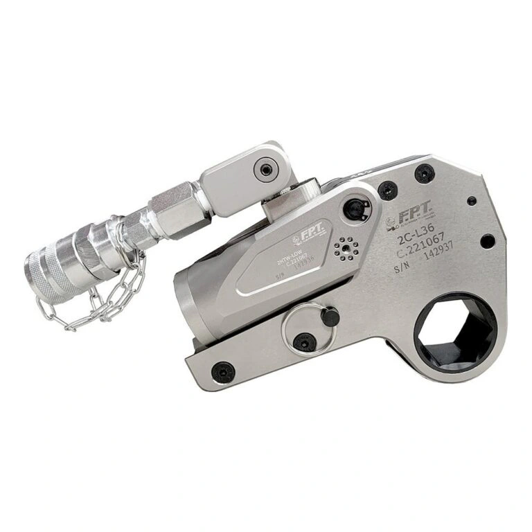 A silver-gray hydraulic torque wrench with attached hose and a hexagonal