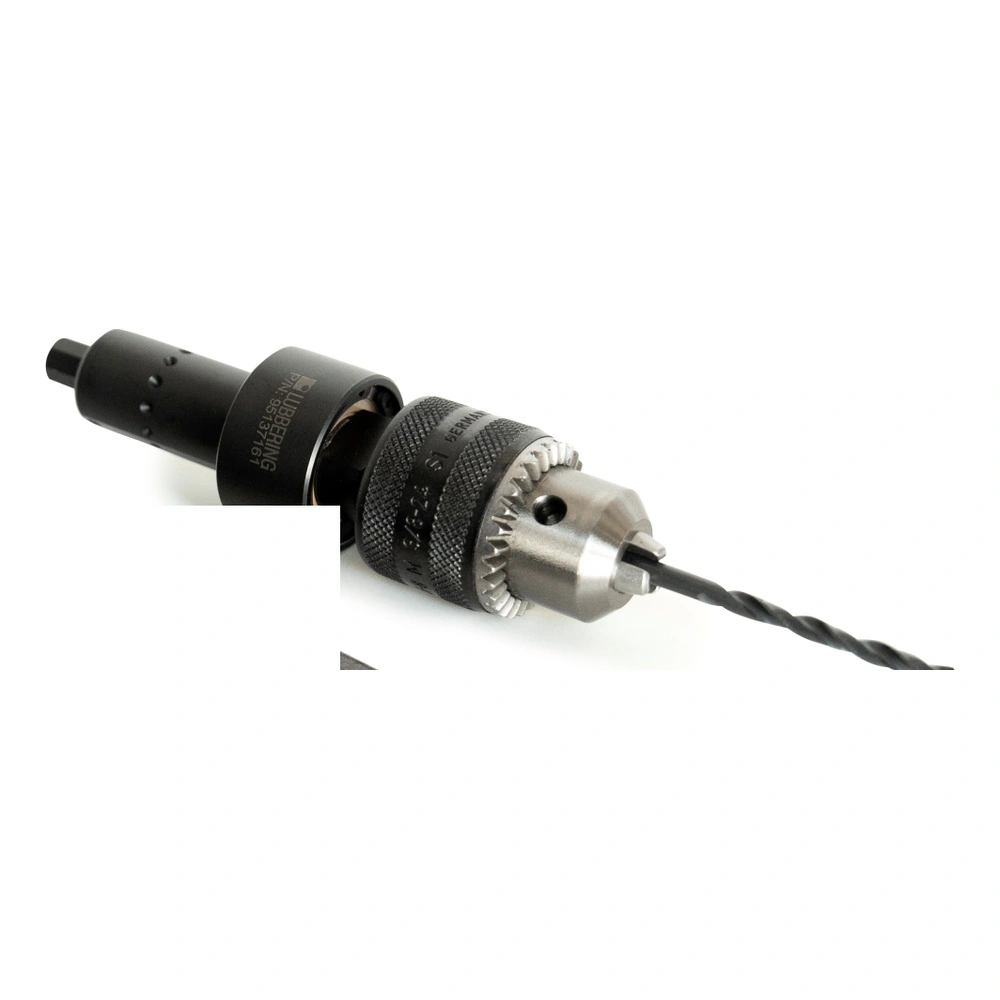 Photo of a black and silver angled drill head with a drill chuck and drill