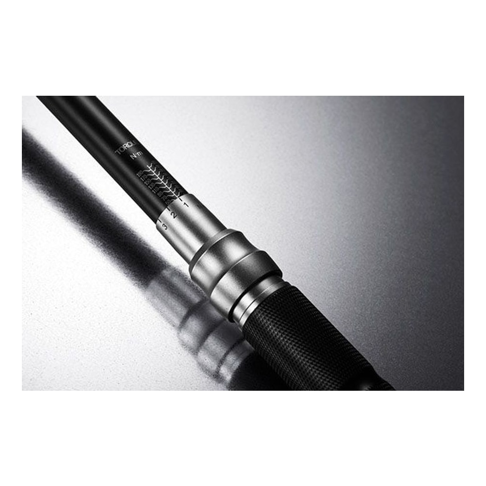Close-up of the adjustment area on a torque wrench handle, with engraved