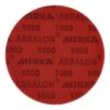 A close-up of a red round disc with MIRKA ABRALON and 1000 printed across