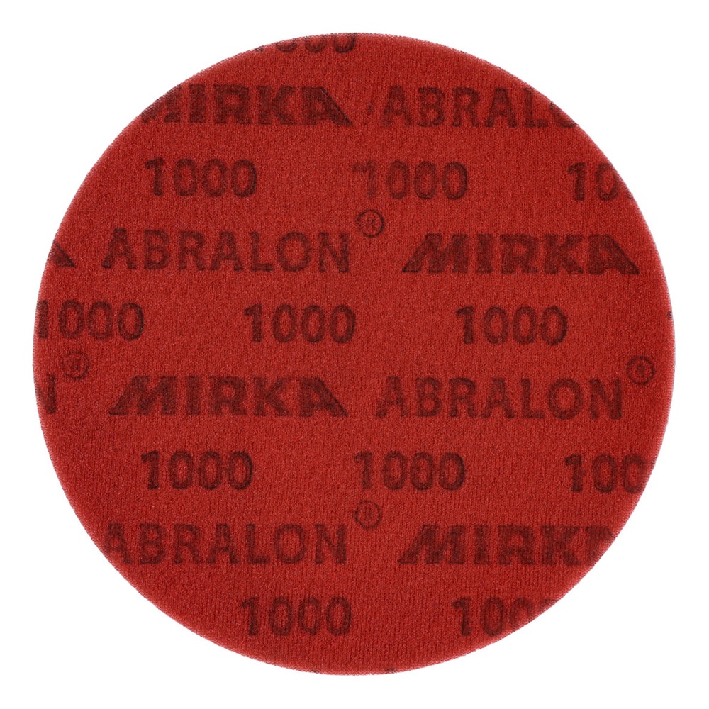 A close-up of a red round disc with MIRKA ABRALON and 1000 printed across