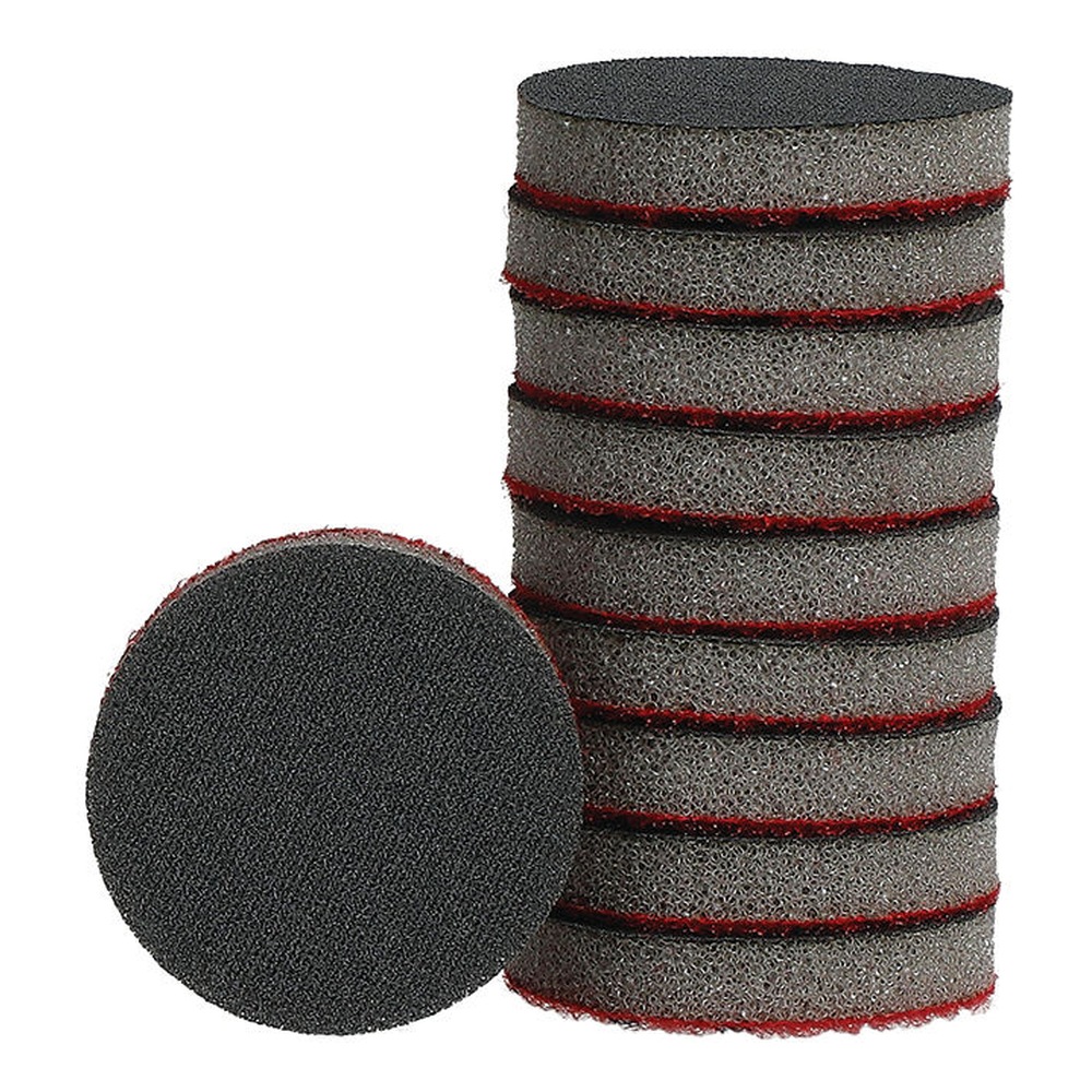 A stack of gray sanding discs with red edges, with one disc placed in front