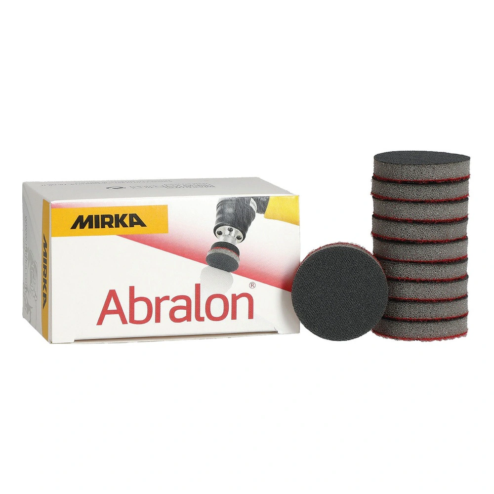 A printed product box with a stack of gray sanding discs and one additional