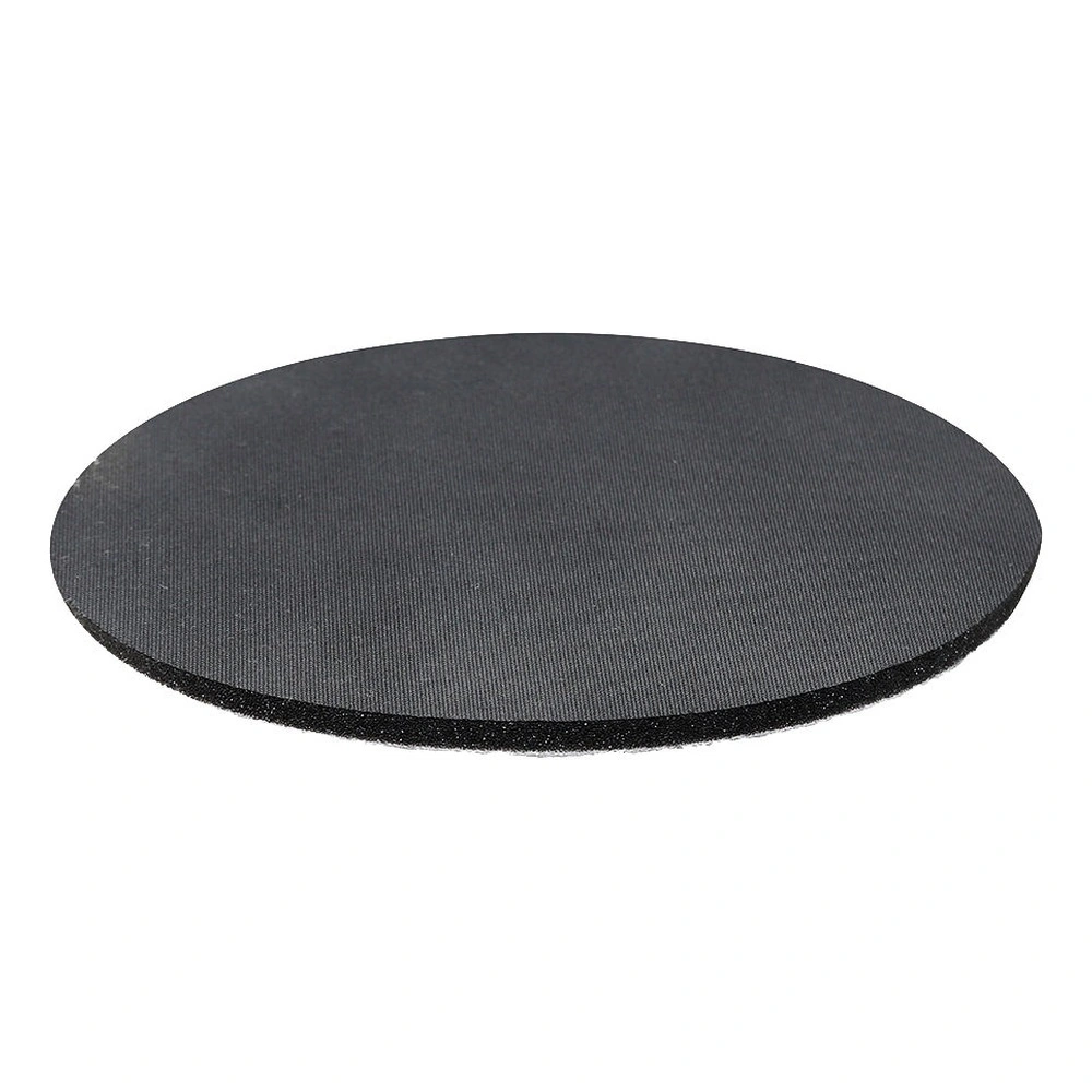 A round black sanding disc shown at a low angle on a white background