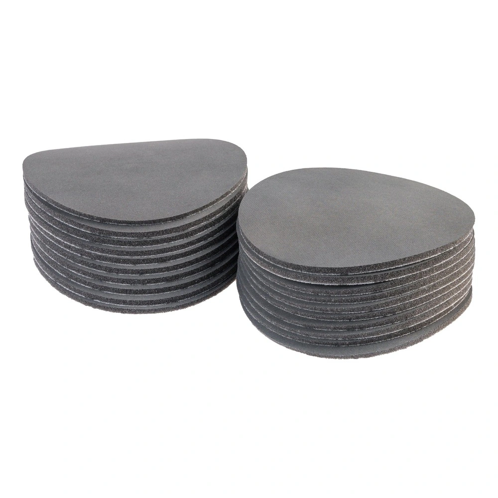 Two stacks of round gray sanding discs shown side by side on a white