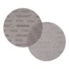 Two overlapping round sanding discs, one darker with printed text and one