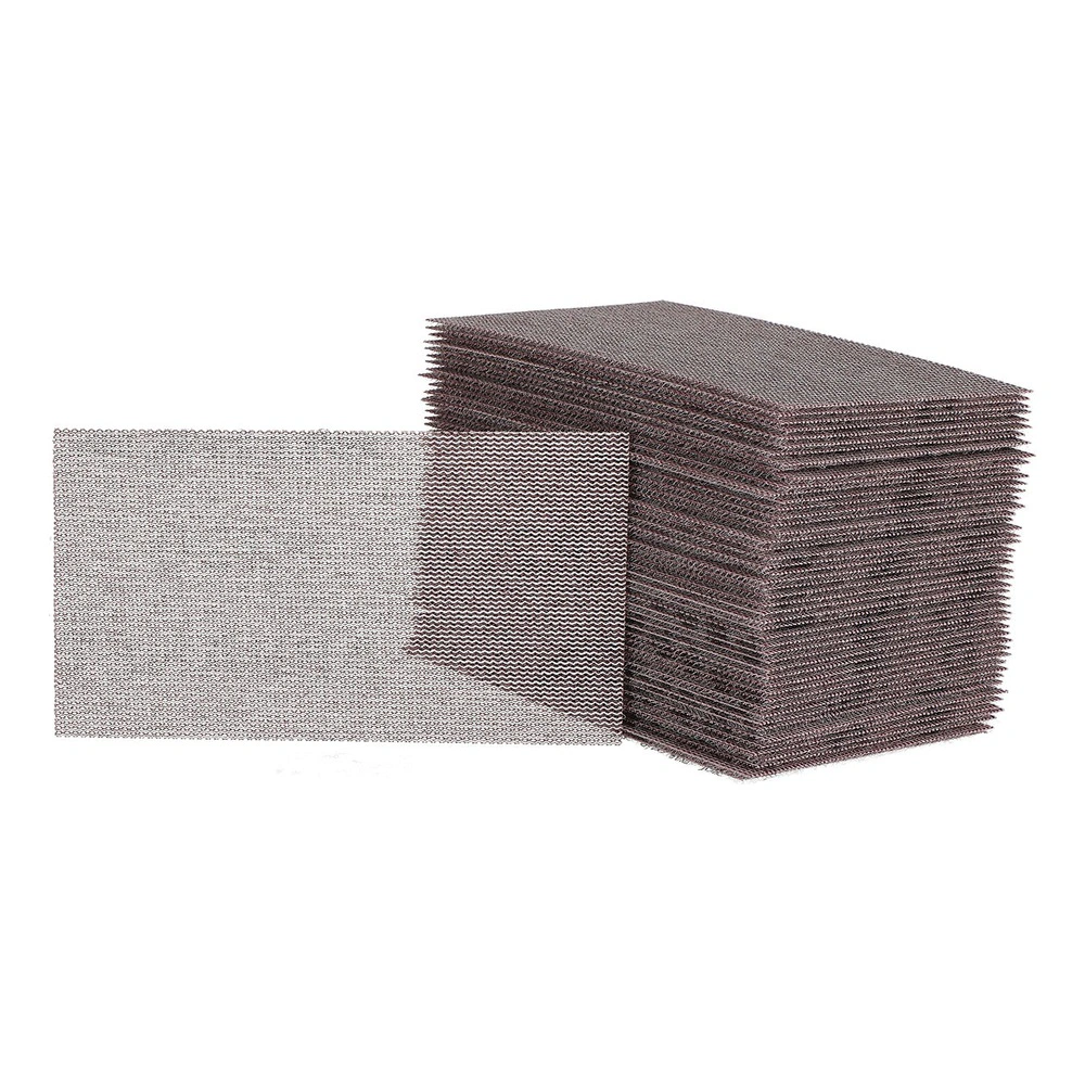 A stack of rectangular sanding mesh sheets, with one separate sheet placed