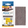 An opened Mirka Abranet cardboard pack beside one rectangular brown-gray
