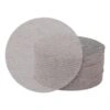 A stack of round sanding discs with one disc placed in front, on a white