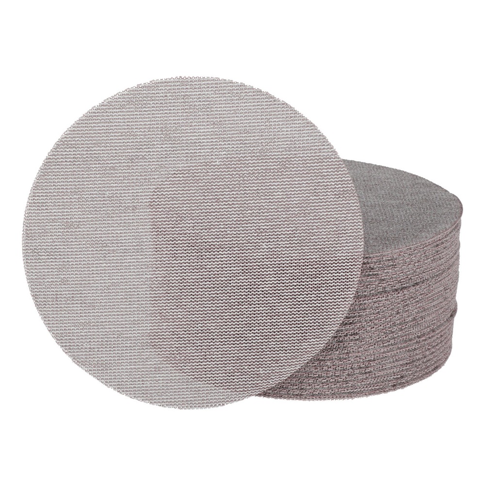A stack of round sanding discs with one disc placed in front, on a white