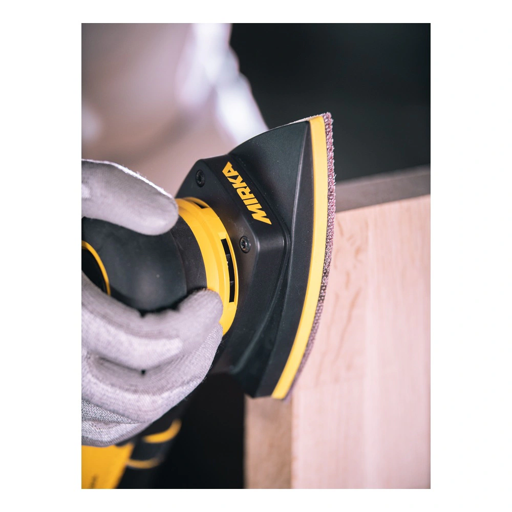 A close-up of a yellow-and-black triangular sander against the edge