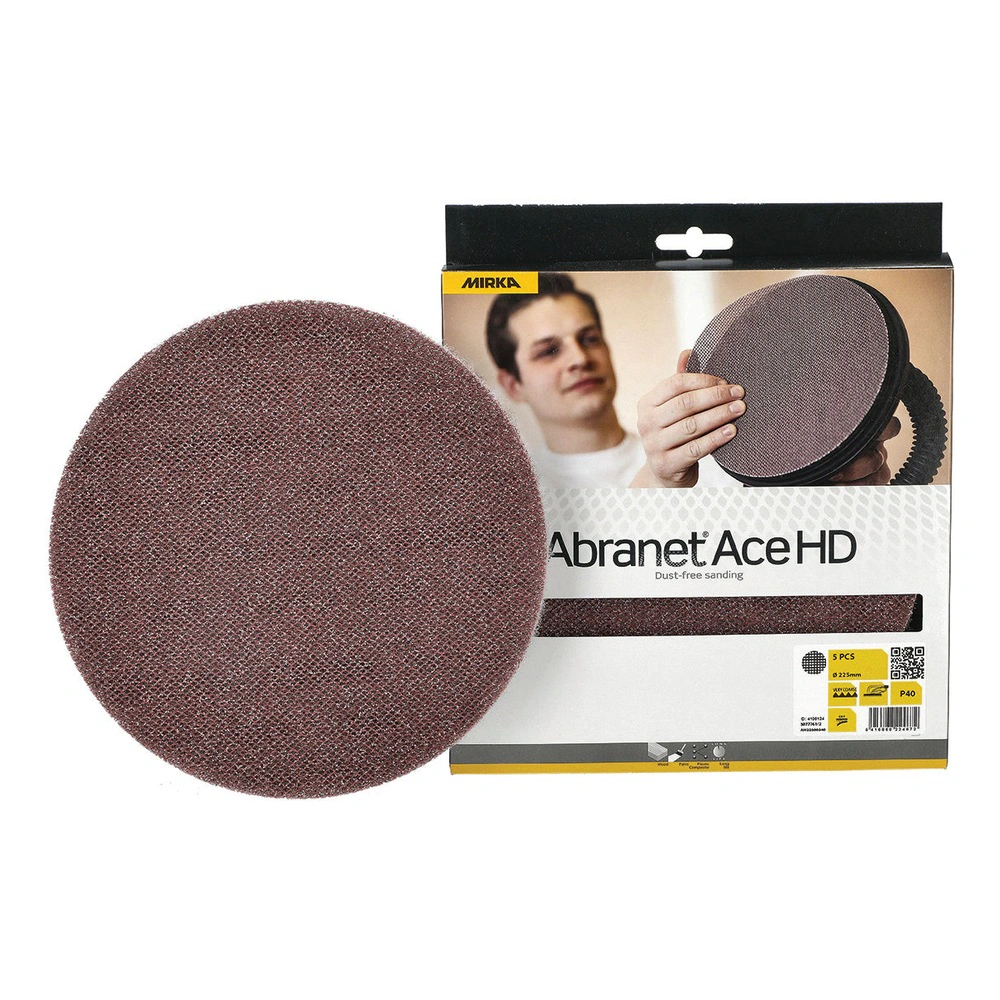 A round mesh sanding disc in front of a cardboard product package