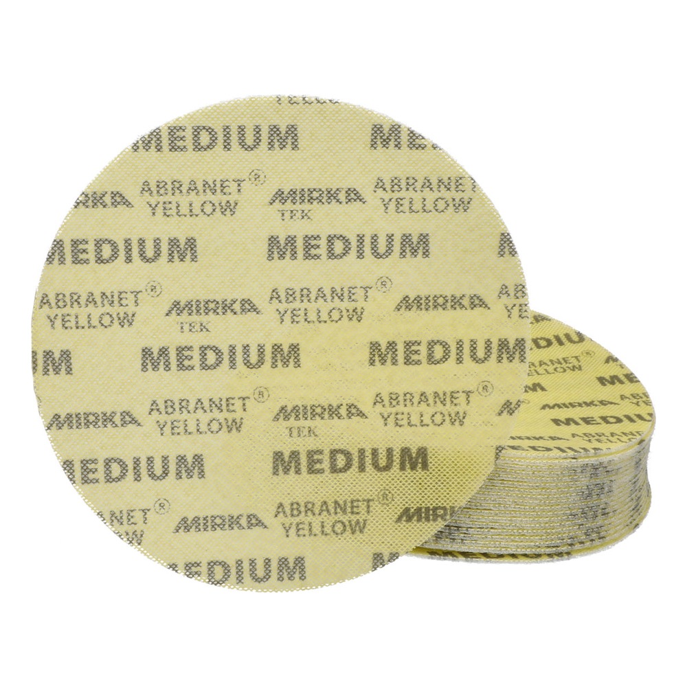 A stack of pale yellow sanding discs is shown at the back, with one large