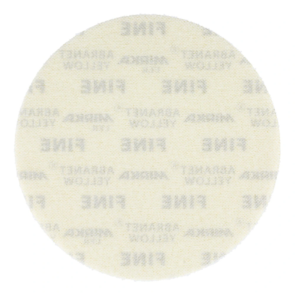 A very light round sanding disc with faded printing on a mesh surface, shown