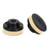 Two black round pads shown at an angle, with a light-colored side layer
