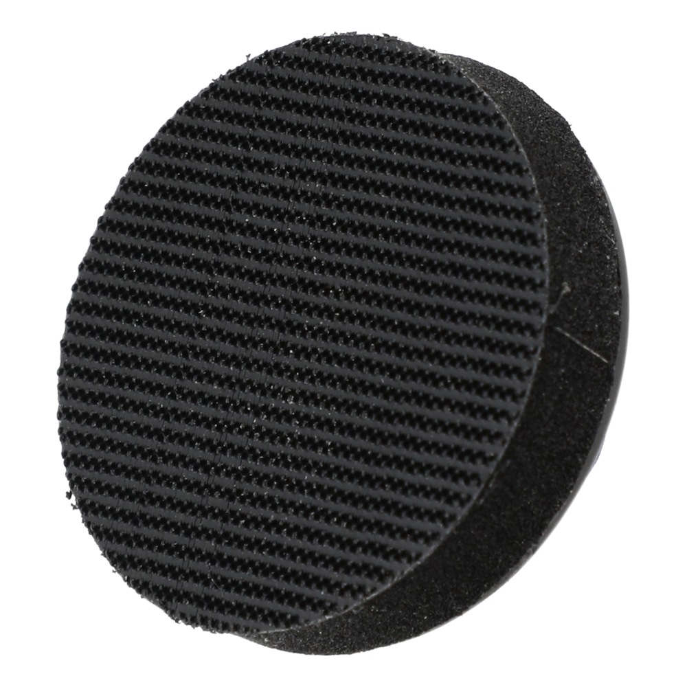 Two overlapping black round disks, with the front one having a rough