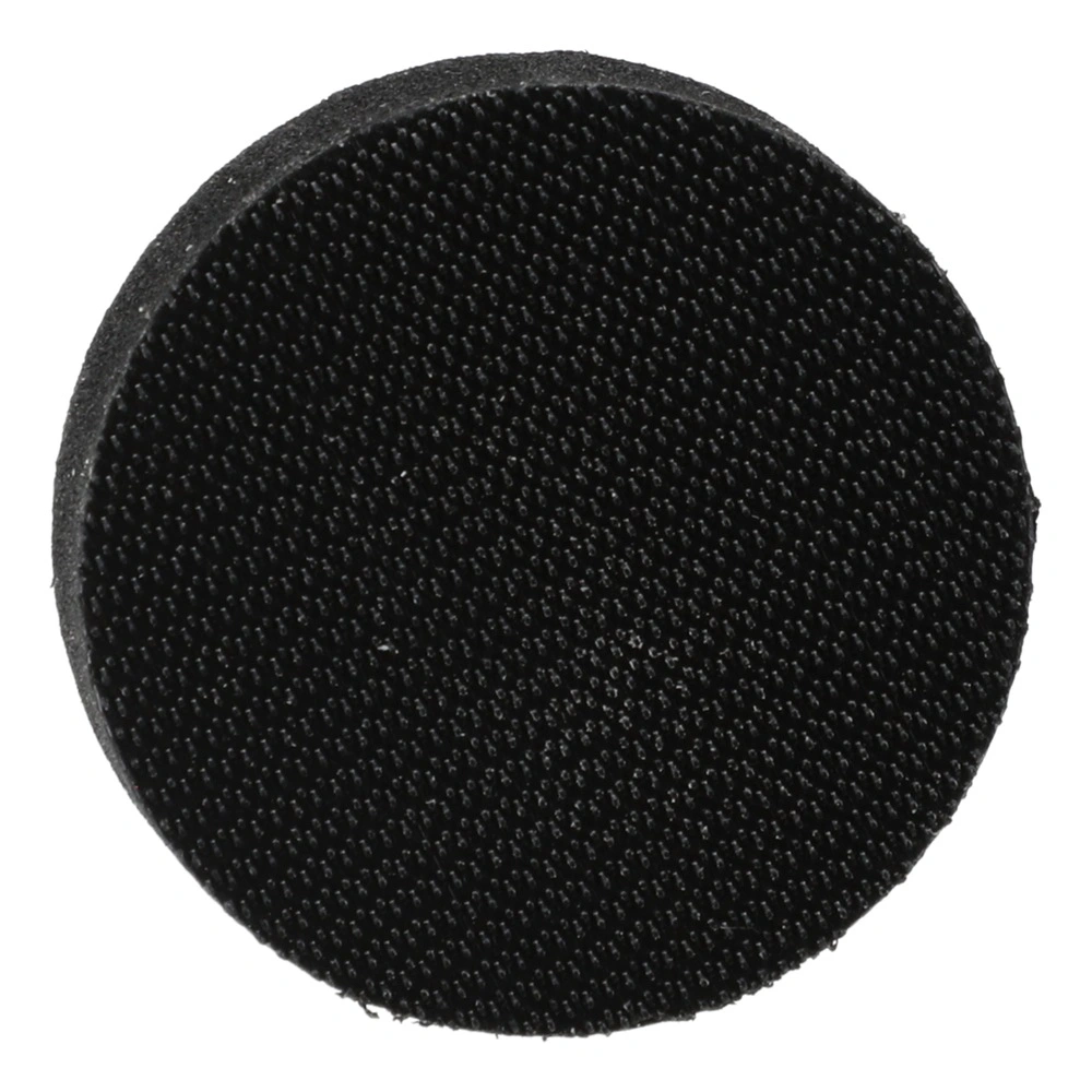 Round black disc with a fine hook-and-loop surface, shown head-on