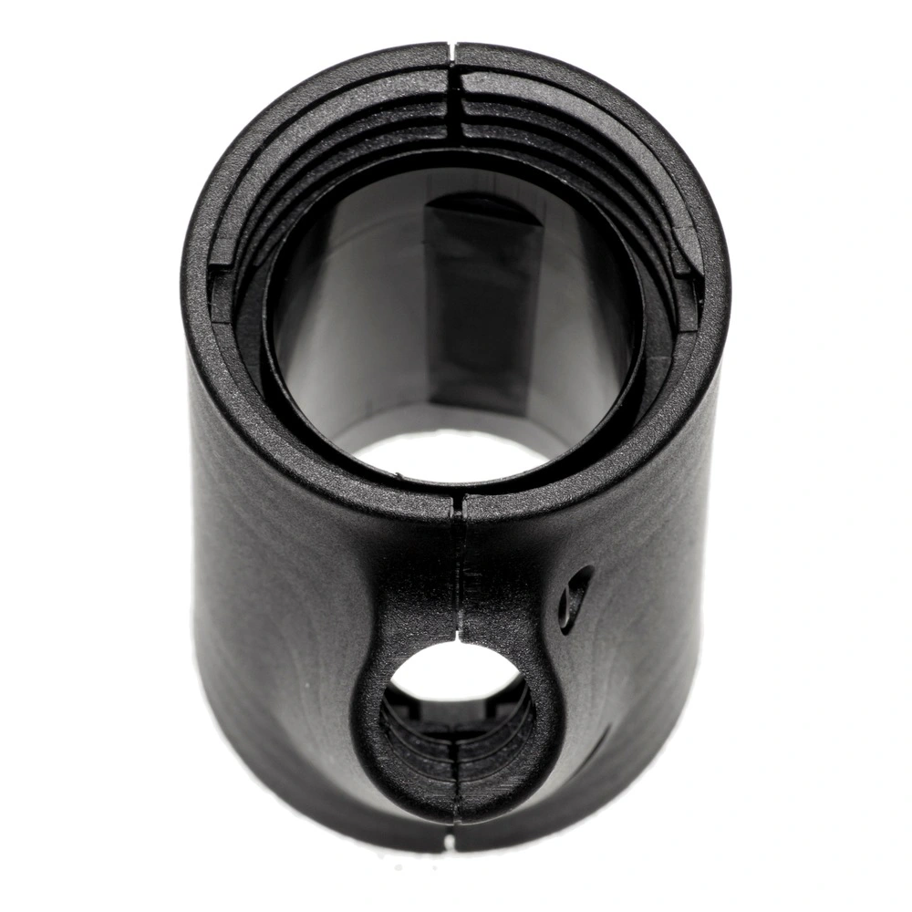 Black cylindrical part with internal threads at the top opening and a round