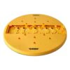 A round yellow-orange sanding pad with many holes, shown from a low angle