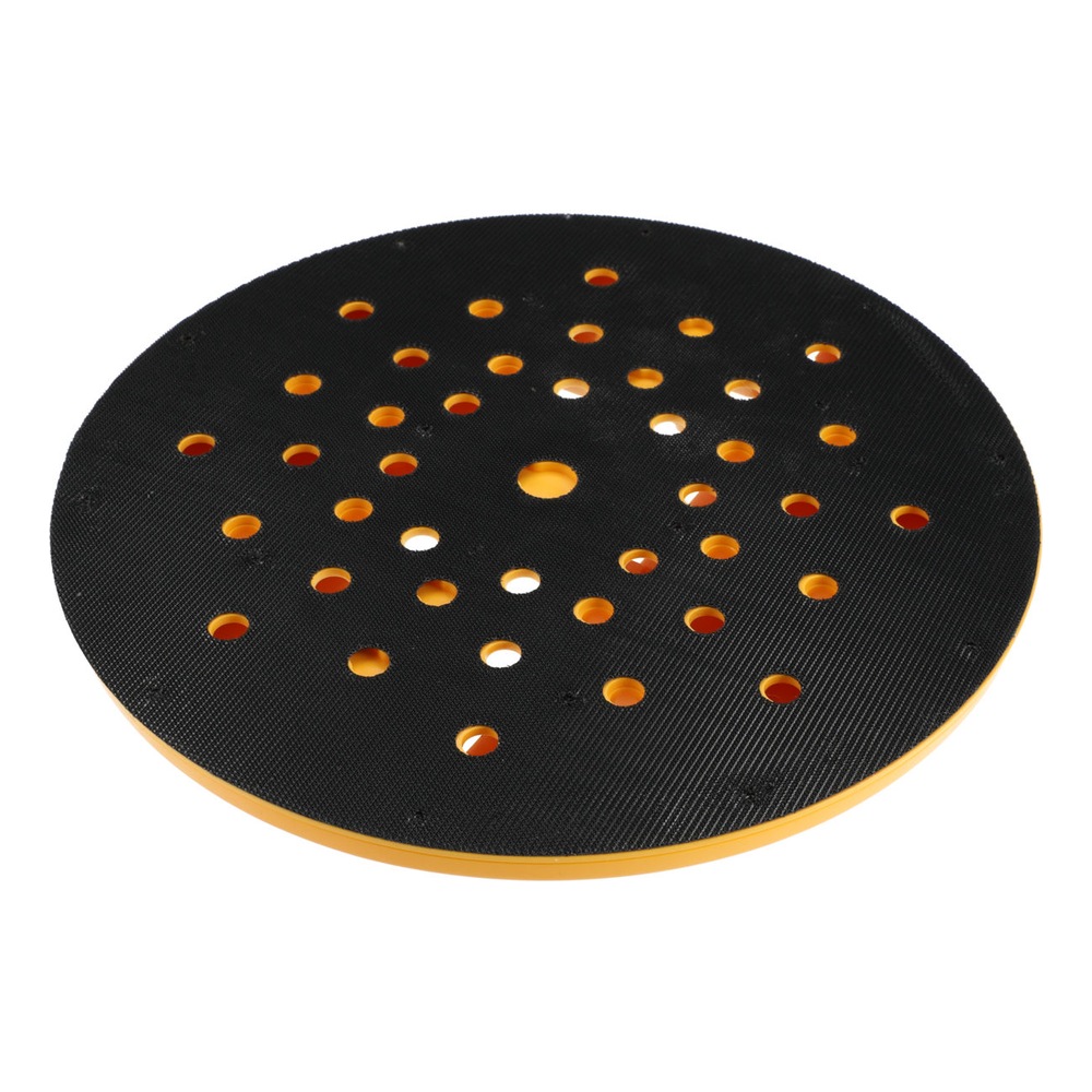 A round black sanding pad with many holes and some holes showing orange