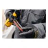 A gloved person holding a cordless file belt sander with the abrasive belt