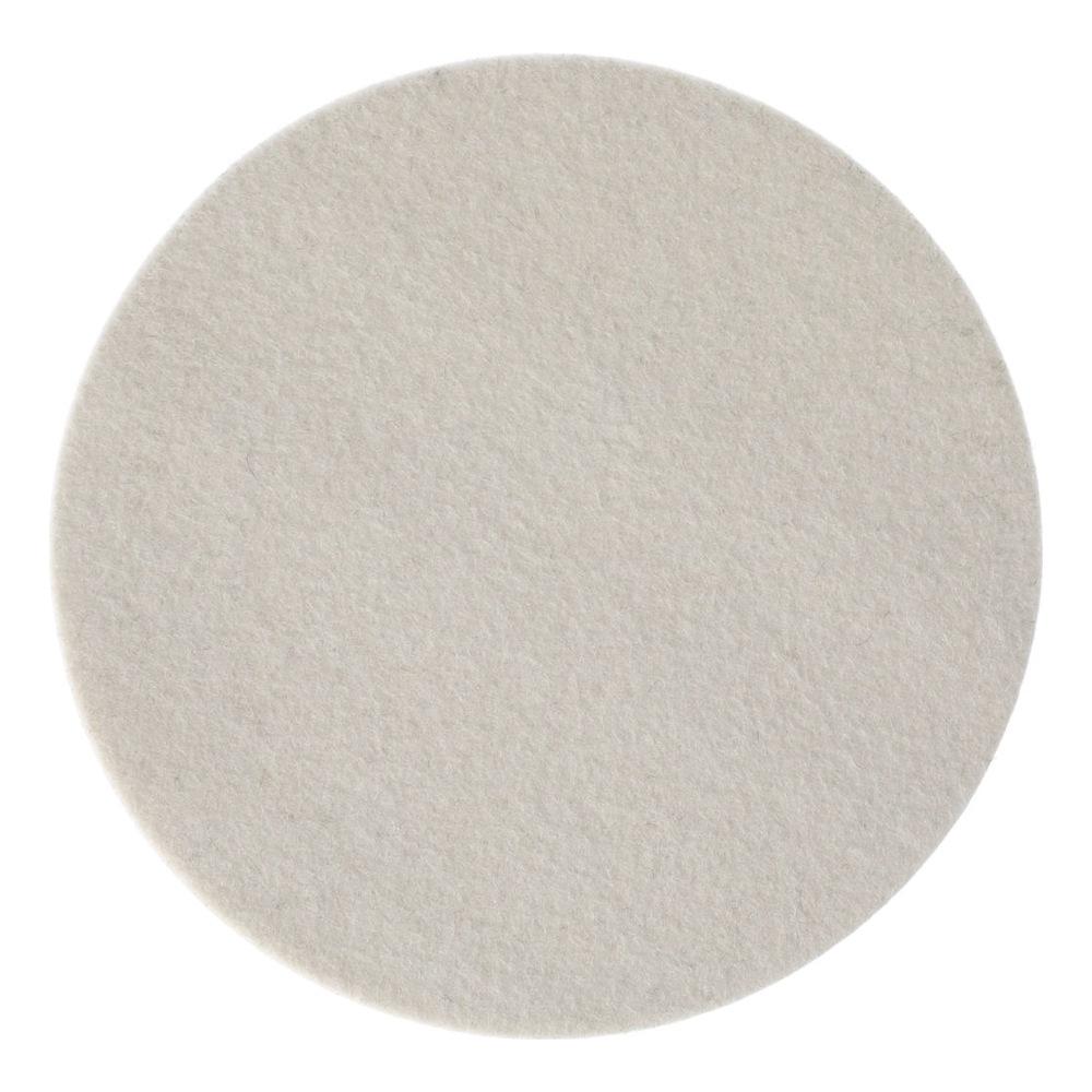 A round off-white felt pad, shown from above on a white background