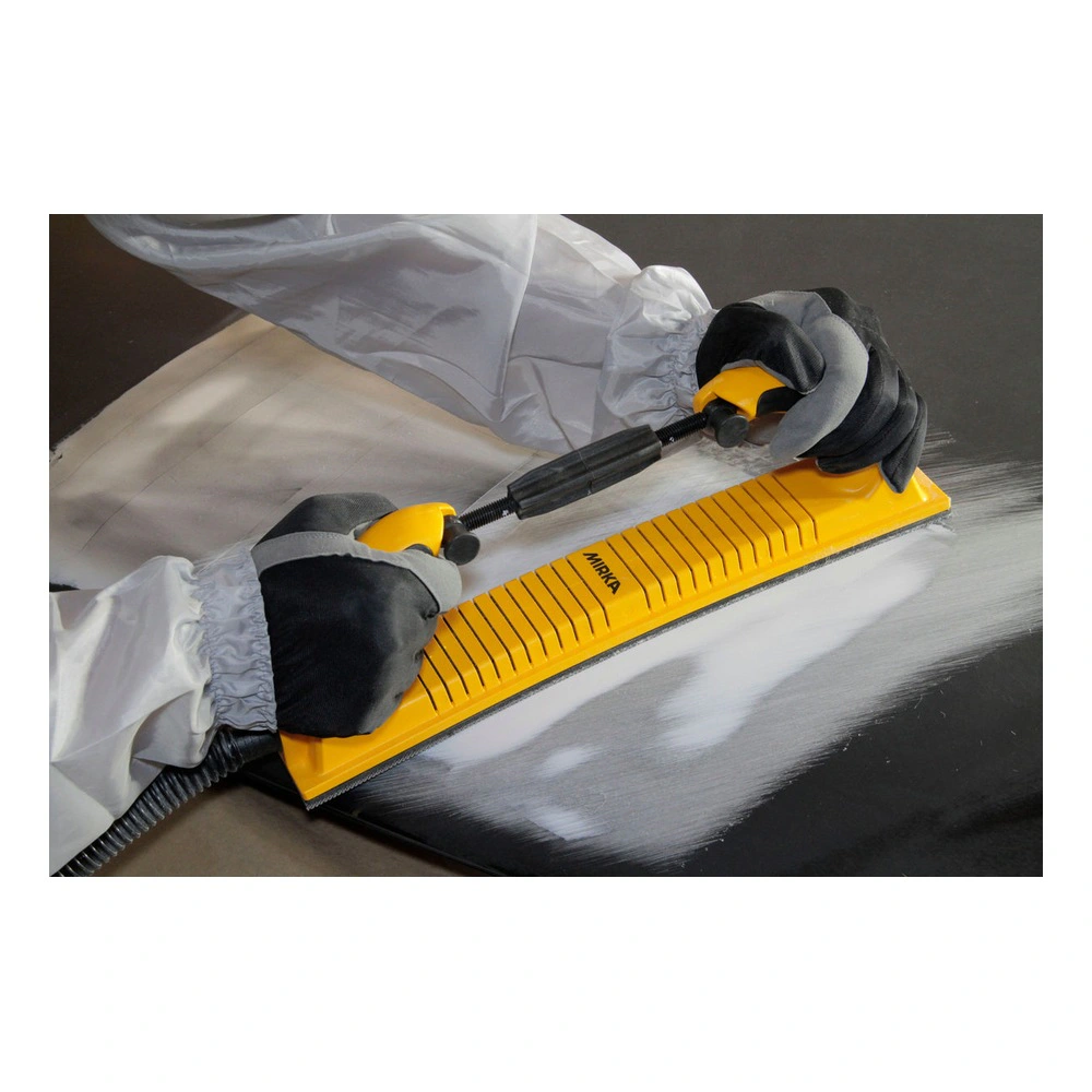 Application scene of a yellow rectangular sanding board with grooves, held