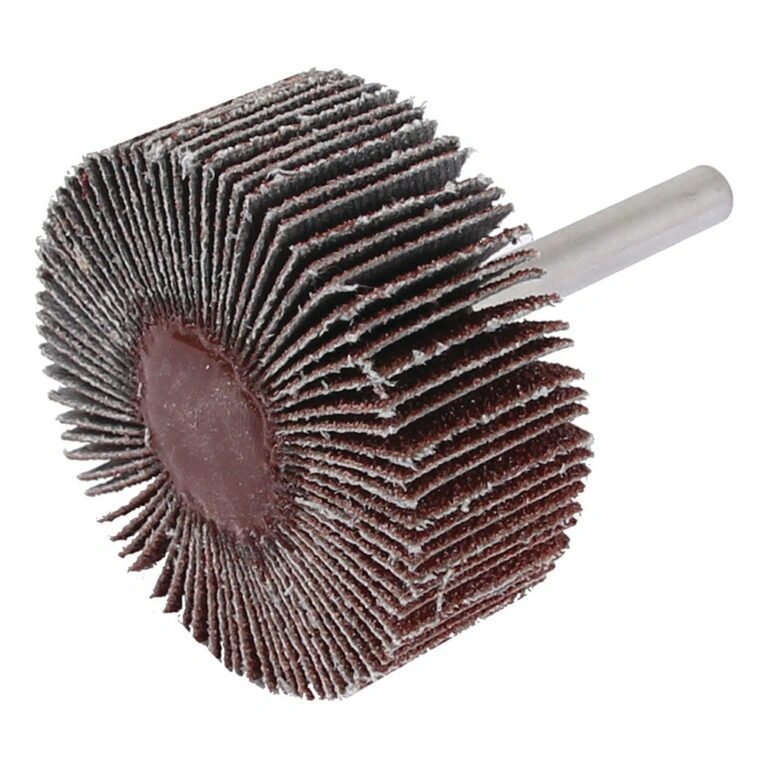 A flap wheel abrasive with a metal shank, shown at an angle on a white