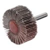 A flap wheel abrasive with a metal shank, shown in angled side view