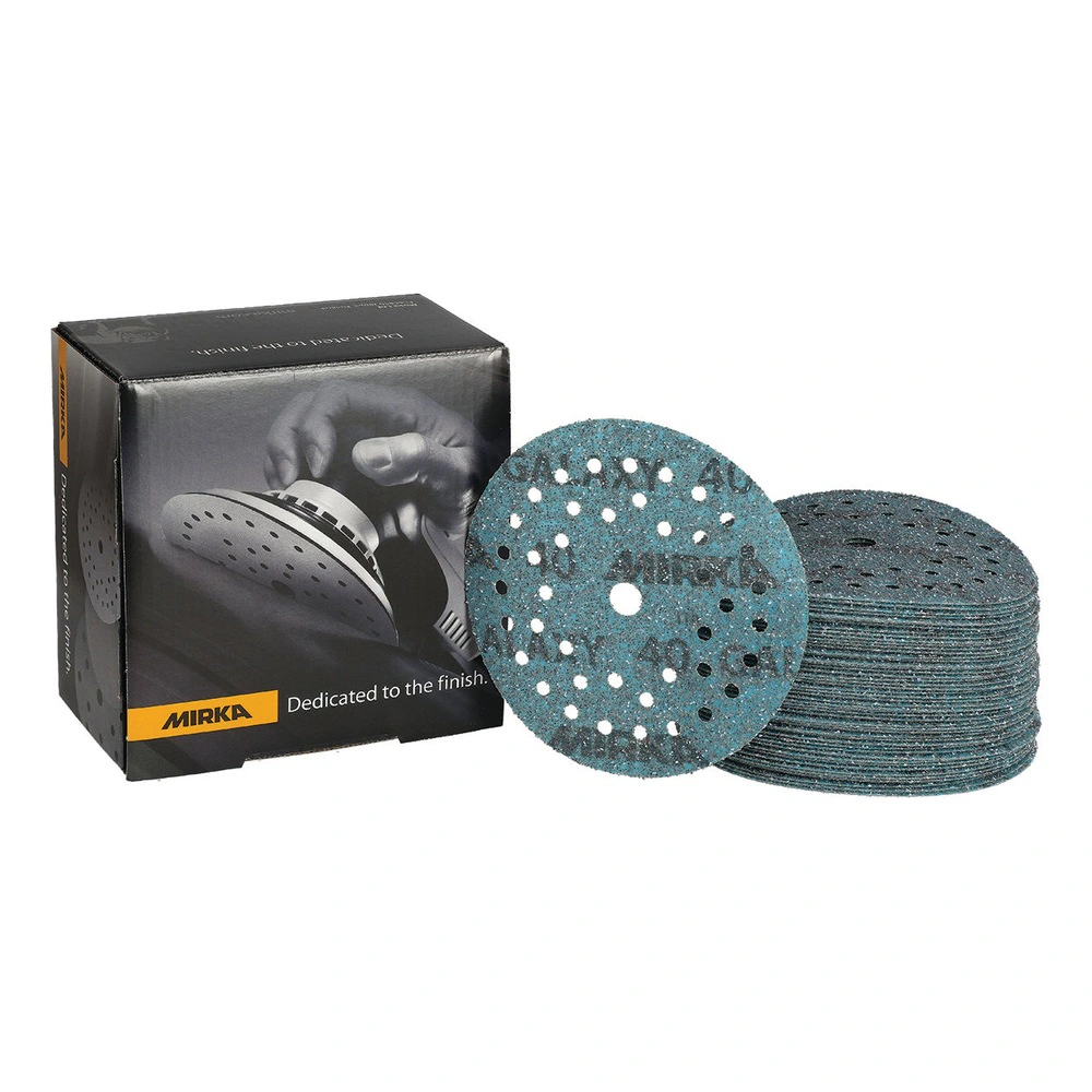 A black product box beside a stack of sanding discs with one disc shown