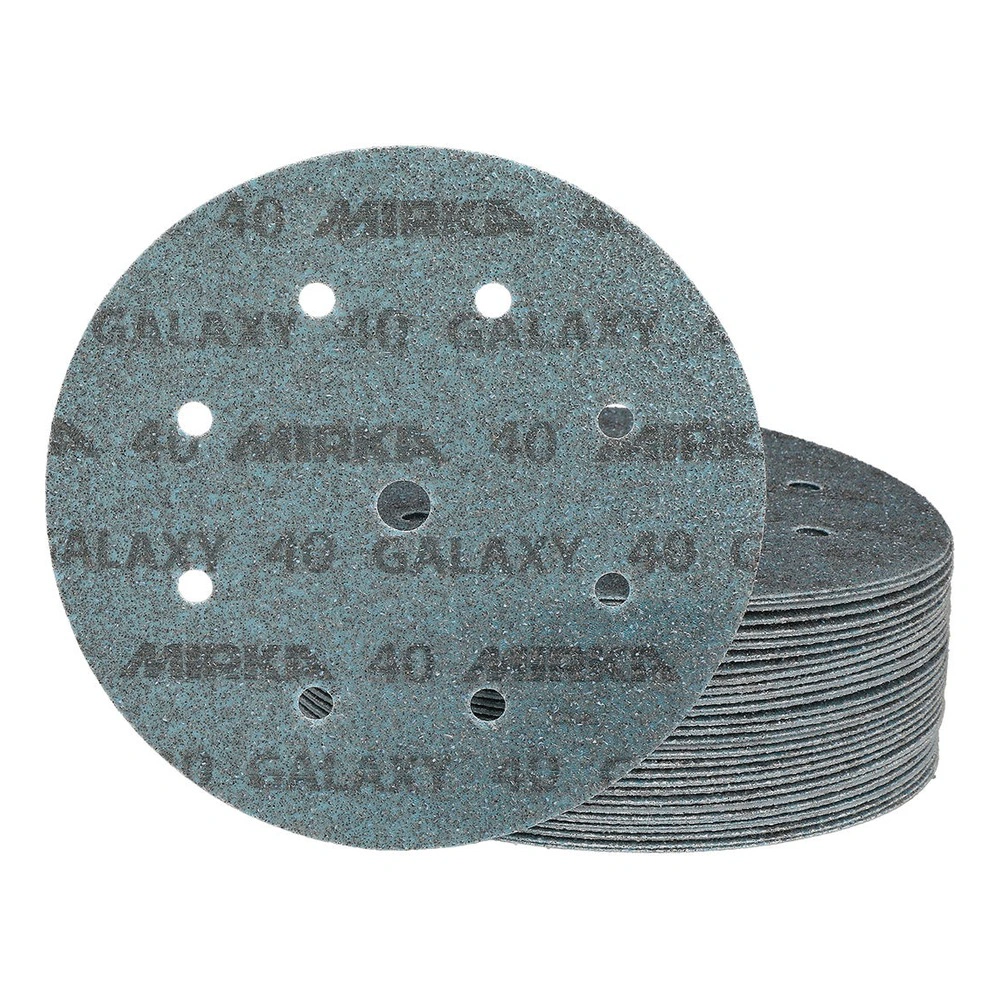 Close-up of a blue-gray round sanding disc with circular holes and printed