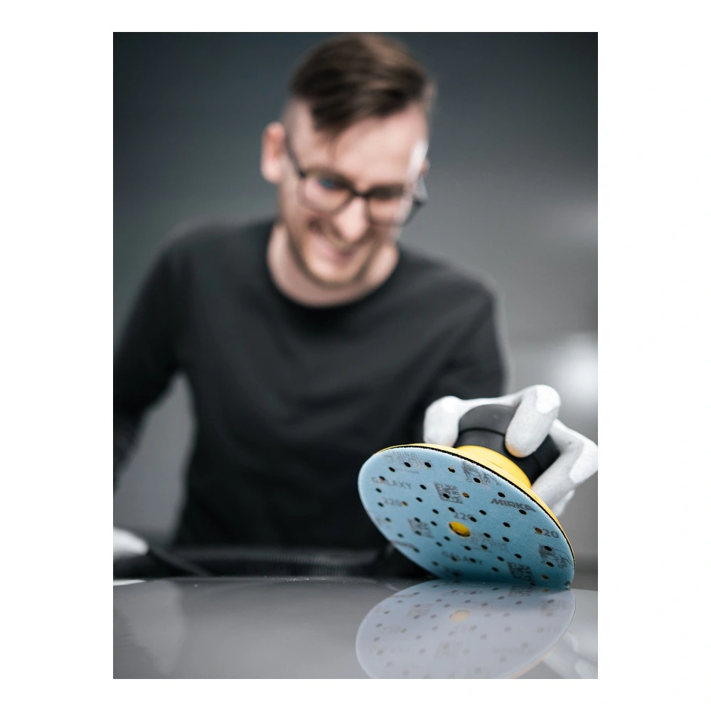 Yellow hand sander with perforated disc