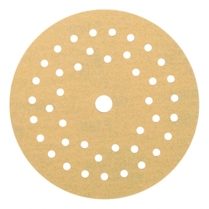 Round gold sanding disc with many holes arranged in rings and one center