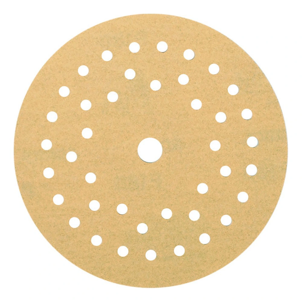 Round gold sanding disc with many holes arranged in rings and one center