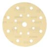 Light-colored round sanding disc with 17 holes and an open center