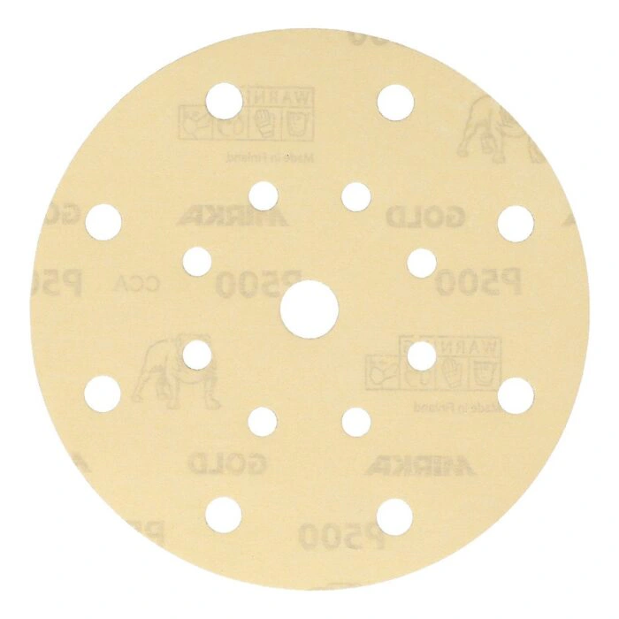 Light-colored round sanding disc with 17 holes and an open center