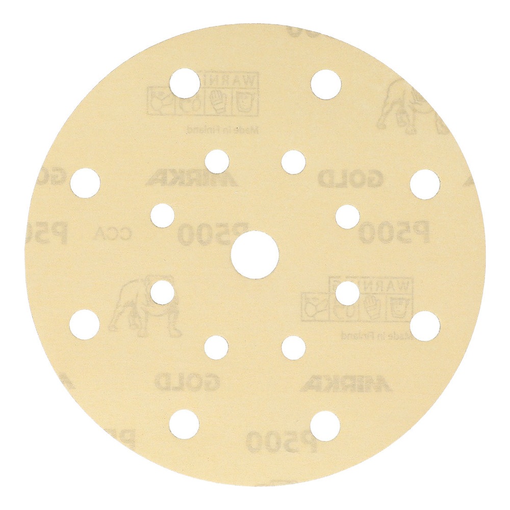 Light-colored round sanding disc with 17 holes and an open center