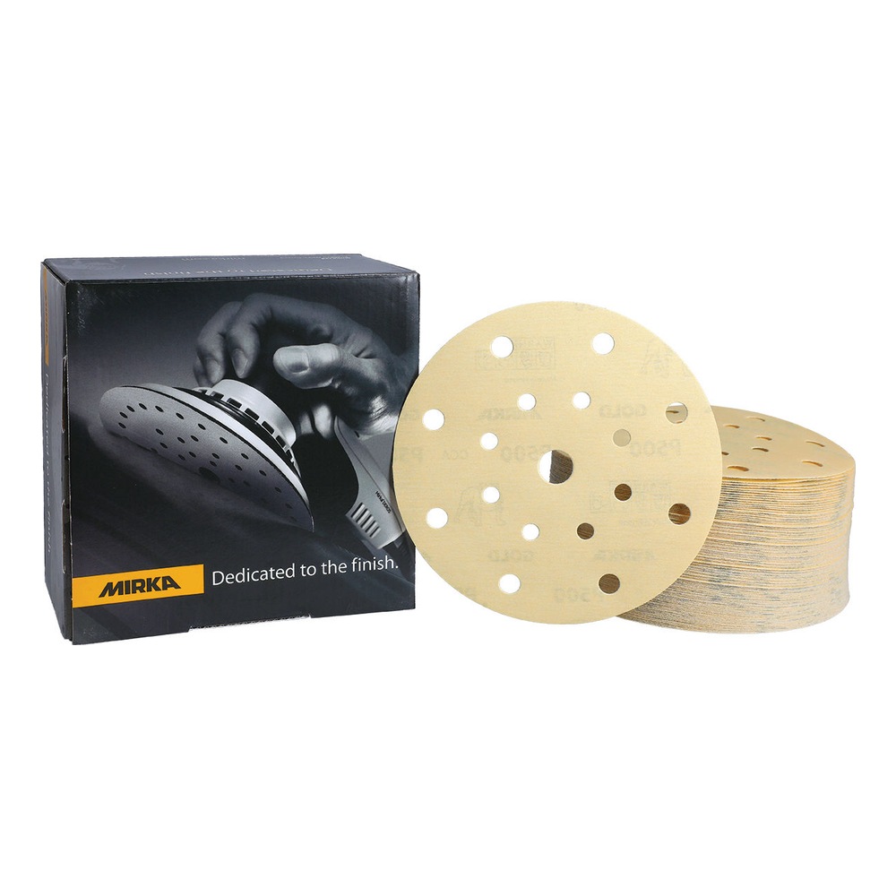 Black Mirka box beside a yellowish sanding disc and a stack of identical
