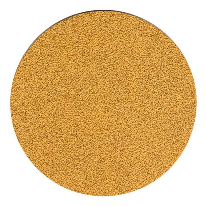 A round yellow sanding disc with an even gritty texture, on a white