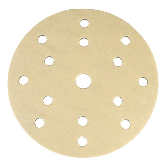 A light-colored round sanding disc with multiple holes, shown front-on